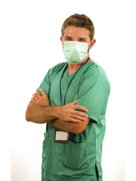 Attractive and successful medicine doctor or nurse man posing confident for hospital staff corporate portrait  in green medical uniform and face mask isolated on white — 스톡 사진