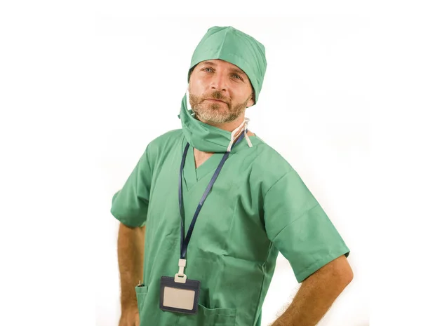 Isolated portrait of attractive and handsome medicine doctor or hospital nurse man in surgical bouffant hat and medical scrub smiling happy and confident in health care concept — 스톡 사진