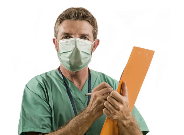Isolated portrait of young medicine doctor or nurse man in face mask holding clipboard medical paperwork on white background in health care and hospital attendant concept — 스톡 사진