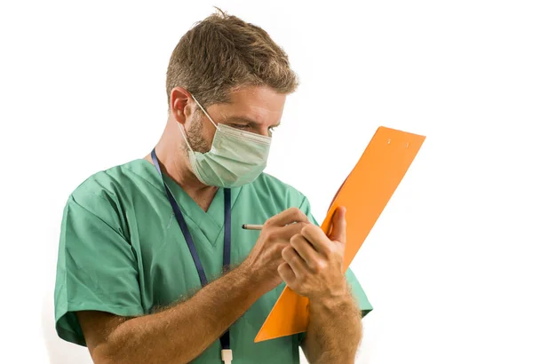 Isolated portrait of young medicine doctor or nurse man in face mask holding clipboard medical paperwork on white background in health care and hospital attendant concept — 스톡 사진