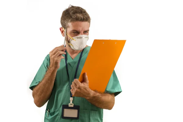 Isolated portrait of young medicine doctor or nurse man in face mask holding clipboard medical paperwork on white background in health care and hospital attendant concept — 스톡 사진