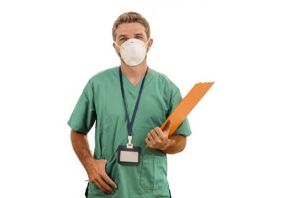 Isolated portrait of young medicine doctor or nurse man in face mask holding clipboard medical paperwork on white background in health care and hospital attendant concept — 스톡 사진