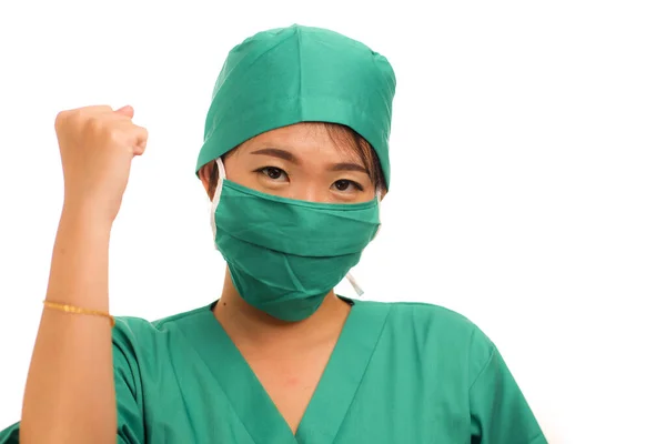 Young beautiful and happy Asian Chinese medicine doctor woman or hospital nurse in medical hat smiling cheerful behind surgeon face mask celebrating successful treatment — 스톡 사진