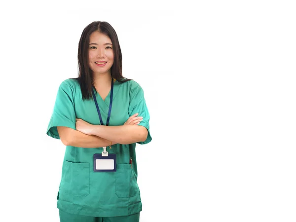 Young beautiful and happy Asian Chinese medicine doctor woman or hospital nurse in green scrubs posing cheerful smiling confident in corporate clinic staff portrait — 스톡 사진