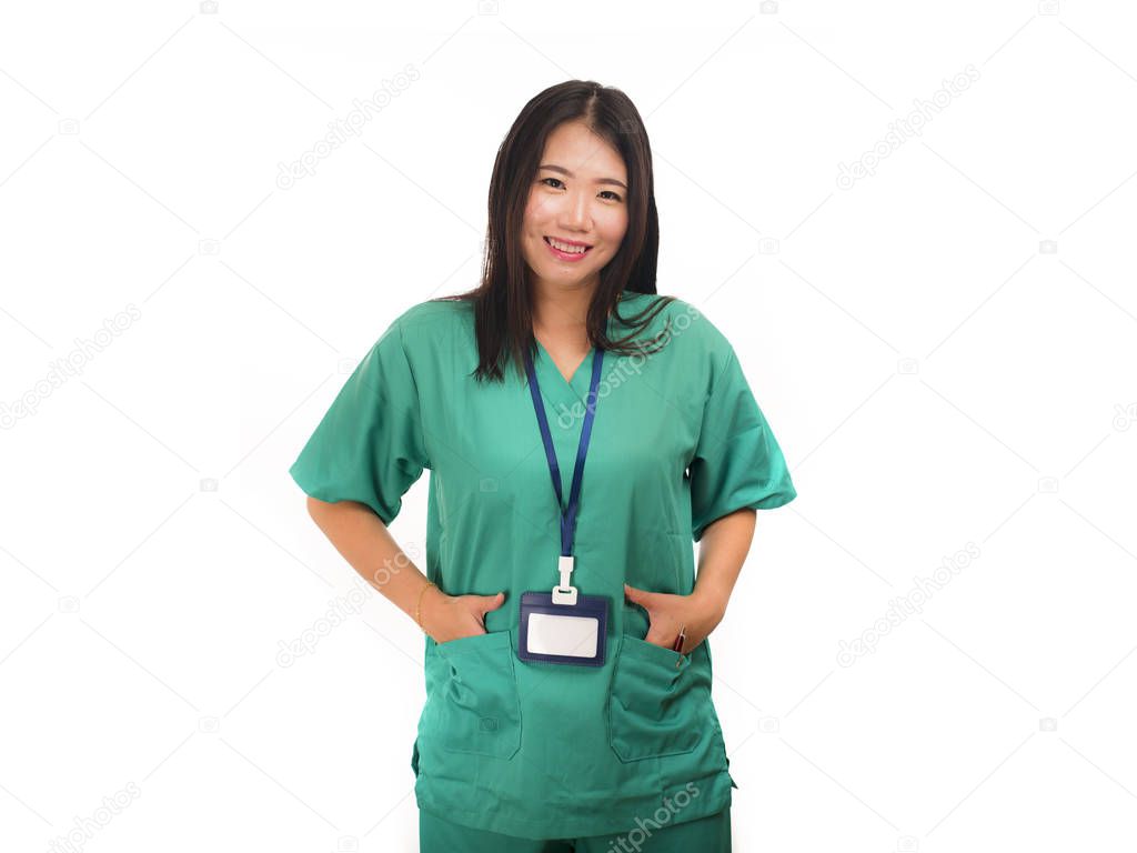 young beautiful and happy Asian Korean medicine doctor woman or hospital nurse in green scrubs posing cheerful smiling confident in corporate clinic staff portrait 