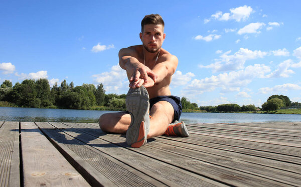 Athletic Man Stretching Before Workout