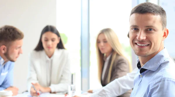 Happy smart business man with team mates — Stock Photo, Image