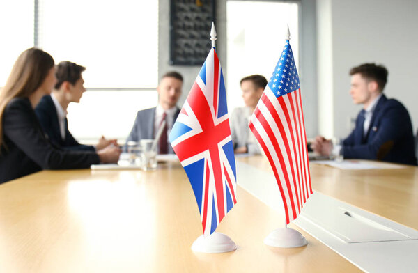 Diversity people talk the international conference partnership. American flag and British flag.