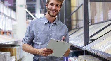 Manager use his tablet for online checking products available clipart