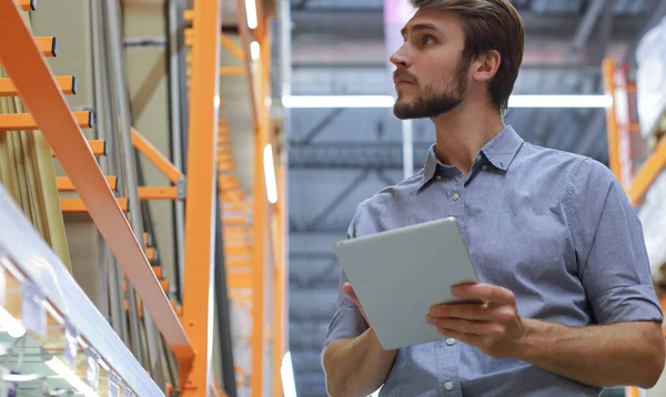 Young Man Shopping Working Hardware Warehouse Standing Checking Supplies His — Stock Photo, Image