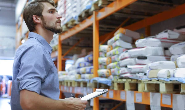 Young Man Shopping Working Hardware Warehouse Standing Checking Supplies His — Stock Photo, Image