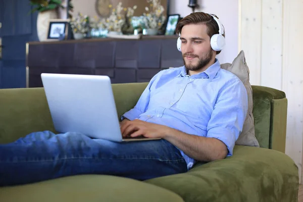 Concentrated Young Freelancer Businessman Sitting Sofa Laptop Working Remotely Online — Stock Photo, Image