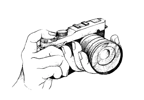 Mão desenhada do fotógrafo segurando câmera em fundo branco — Vetor de Stock