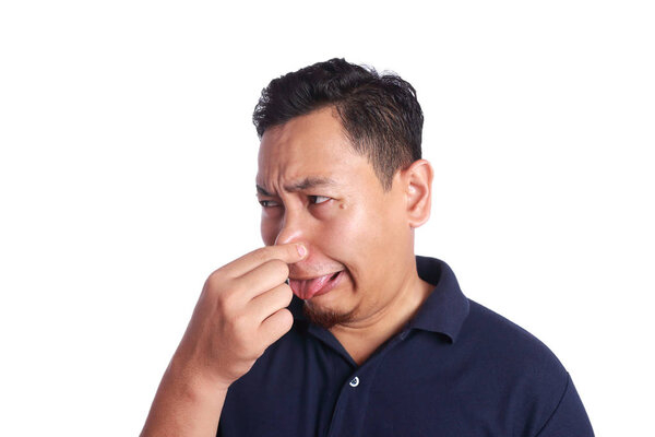 Asian Man Close His Nose Sick of Bad Smell