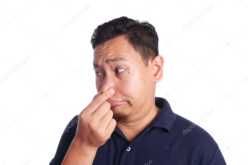 Asian Man Close His Nose Sick of Bad Smell