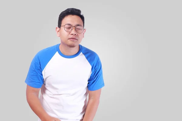 Young Man Showing Relieved Face When Urinating — Stock Image Young Man Showing Relieved Face When Urinating Stock Picture