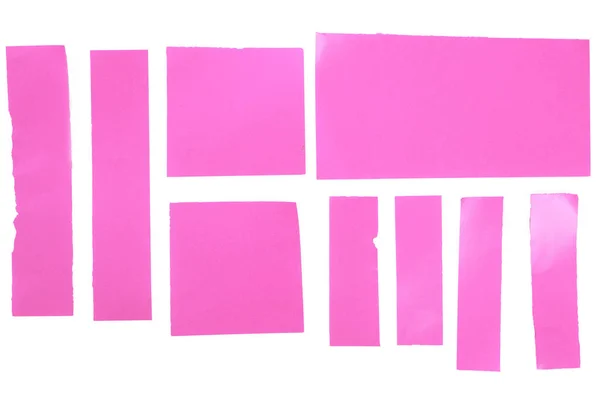 Pedaços de papéis cor-de-rosa isolados em branco — Fotografia de Stock