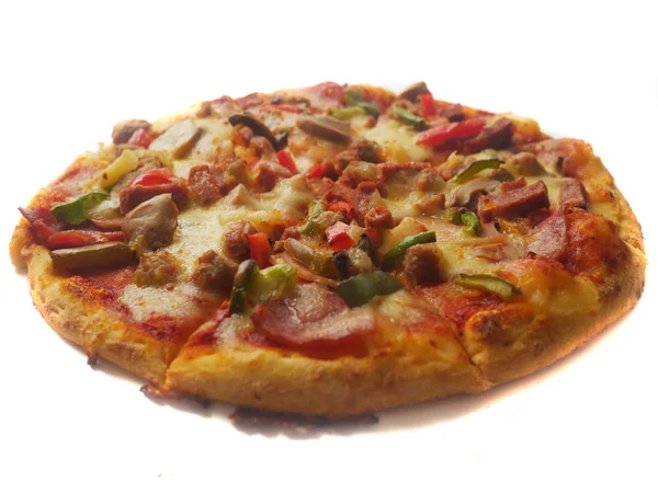 Pizza in round shape, topped with meat, ham, mushroom and veggies Stock Picture