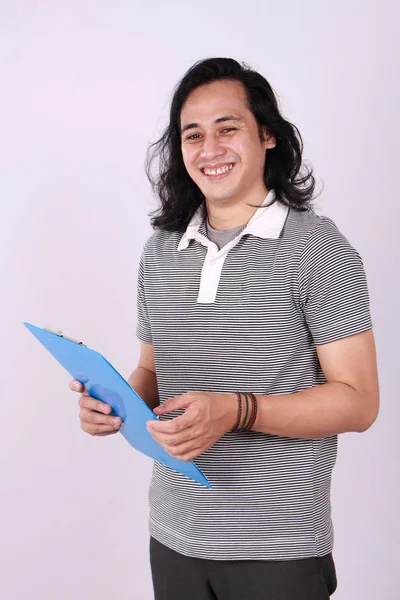 Asian college student holding clipboard and smiling — ストック写真