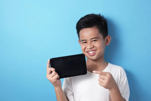 Asian boy shows his tablet screen, tablet smart phone mock up — 스톡 사진
