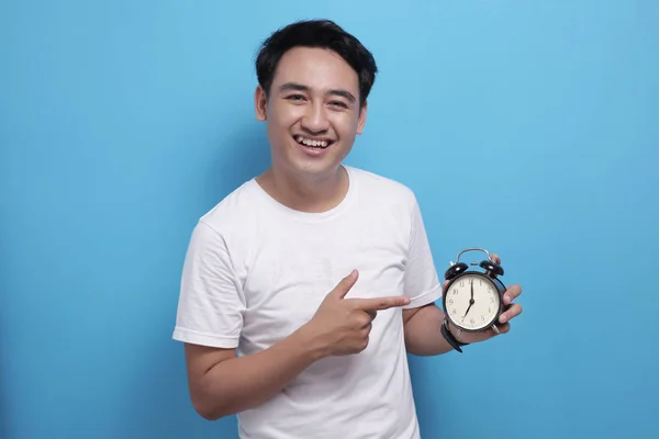 Young Asian Man Shows Time