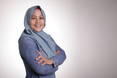 Confident Muslim Lady Smiling Friendly with Crossed Arms