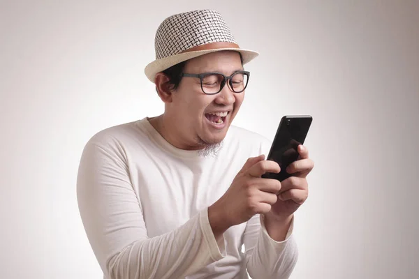 Young Man Texting Reading Chatting on His Phone, Smiling Happy — Stock Photo, Image