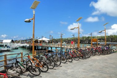 Bicycle parking on the waterfront in Puerto Ayora, Santa Cruz Is clipart