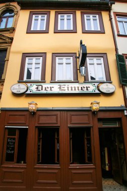 WIESBADEN, GERMANY - MAY 24: Traditional house along small stree clipart