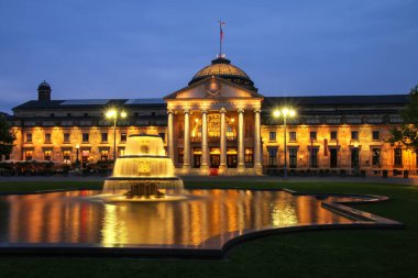 WIESBADEN, GERMANY - MAY 24: Kurhaus and Bowling Green in the ev clipart