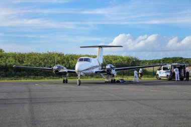 OUVEA, NEW CALEDONIA-JANUARY 6: Air Loyaute airplane at the airport on January 6, 2018 on Ouvea Island, Loyalty Islands, New Caledonia. Air Loyaute is the main airline service for the Loyalty Islands.