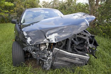 Car after an auto accident reveals damage clipart