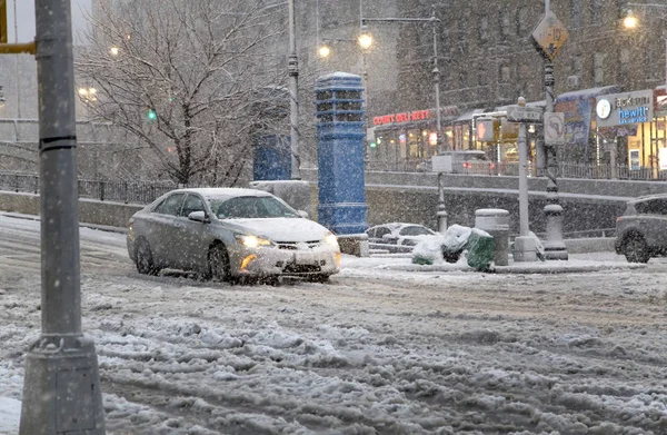 Driver rides vehicle in snow storm on Bronx New York street — Stock Photo, Image