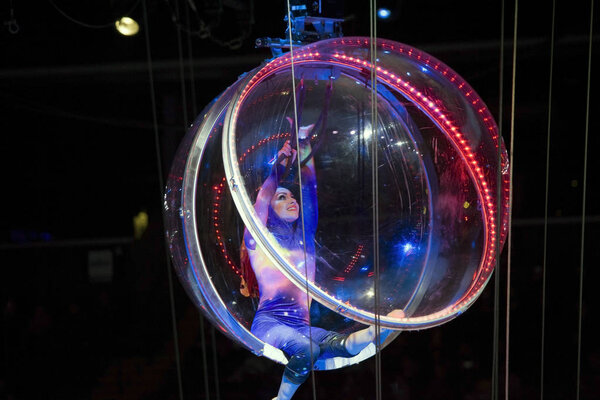 Female contortionist in sphere performing at Barclays Center for