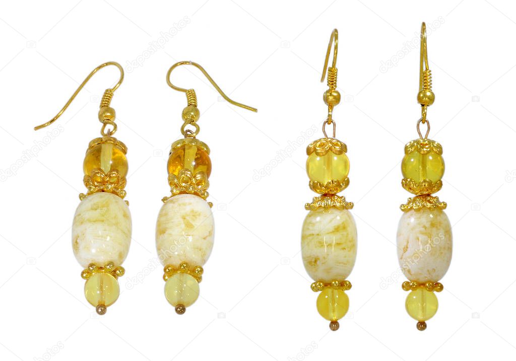 Amber jewelry earrings. Natural Baltic amber. Isolated cut out image on a white background.