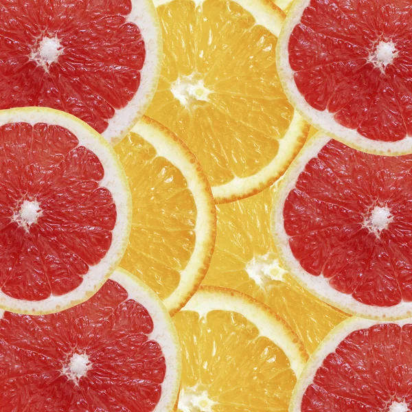 Fruit exotic background. Orange and grapefruit. Top view.