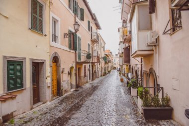 narrow street with buildings in Castel Gandolfo, Rome suburb, Italy  clipart