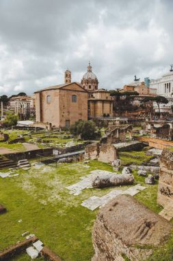 famous roman forum ruins on cloudy day, Rome, Italy clipart