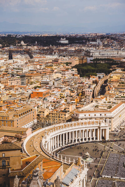 aerial view of St. Peter's square and ancient buildings of Vatican, Italy