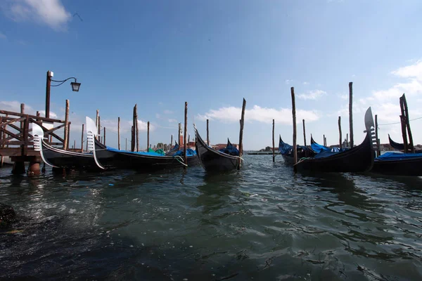 Venice gondolas dotted in San Marco b — стоковое фото