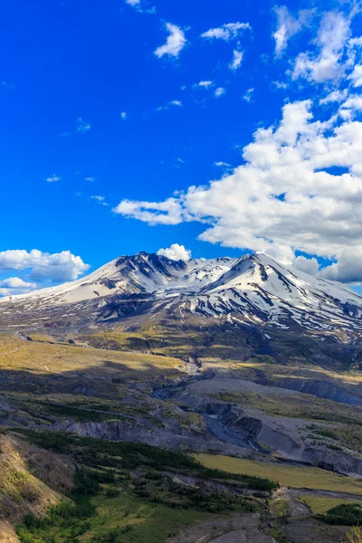 Snow on Mount St. Helens against Blue Sky and cloudscape