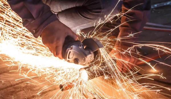Cutting metal with grinder. Sparks while grinding iron — Stock Photo, Image