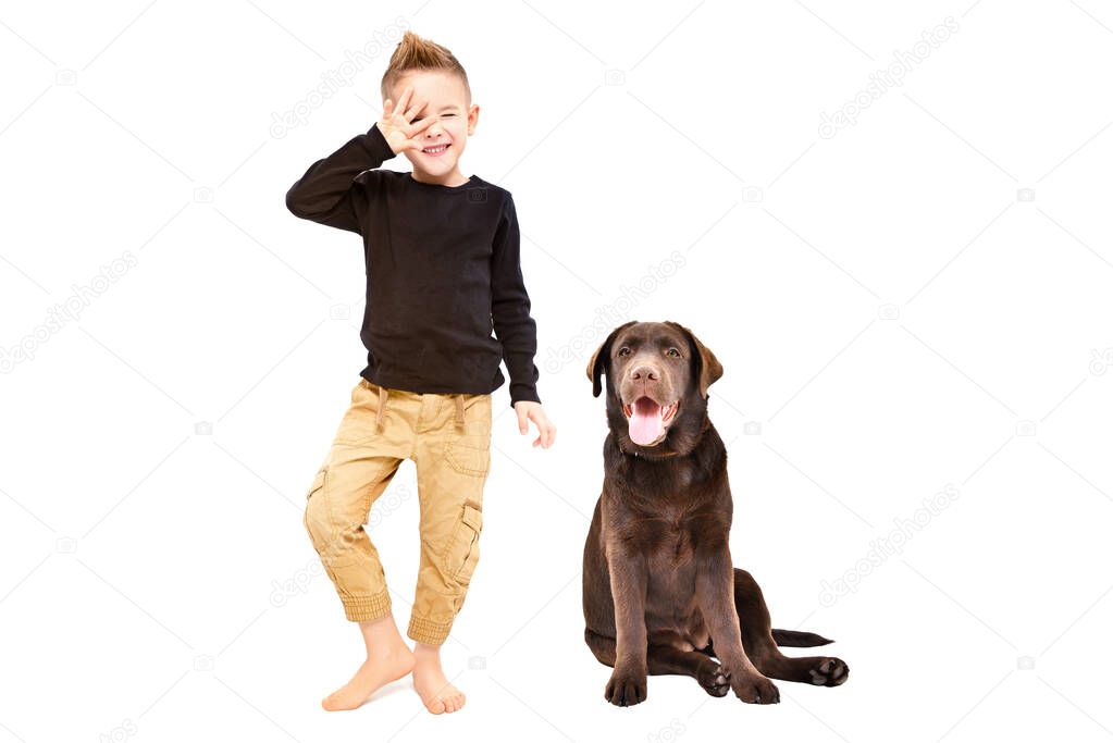 Cheerful pretty boy and Labrador isolated on white background