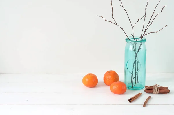 Minimal elegant composition with tangerines and vase — Stock Photo, Image