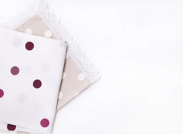 Two  napkins with polka dots on white wooden table. Top view — Φωτογραφία Αρχείου