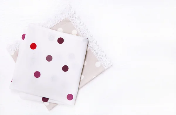 Two  napkins with polka dots on white wooden table. Top view — Φωτογραφία Αρχείου