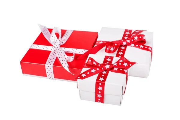 Three present boxes with ribbons isolated on white — Stock Photo, Image