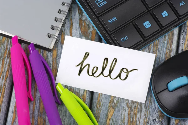 Inscription Hello on a desk Stock Picture