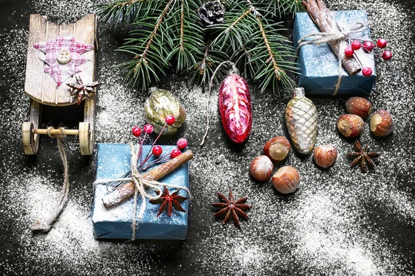 Christmas sleigh and box with gifts — Stock Photo, Image