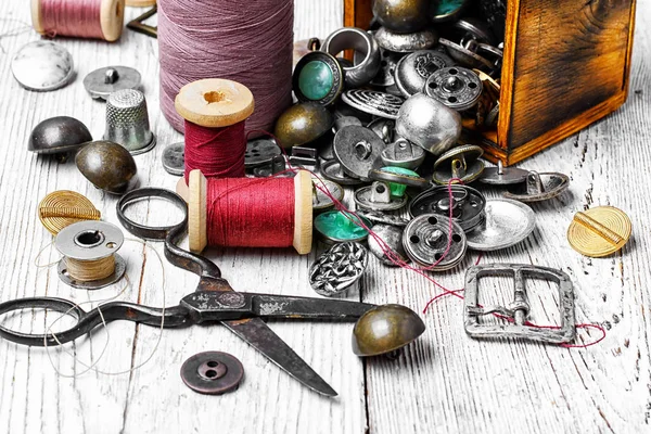 Set of threads,stylish iron buttons and scissors — Stock Photo, Image